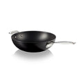 Black stir-fry pan with silver handles on a white background