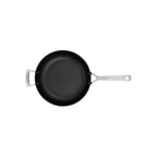 Black frying pan with silver handles on a white background