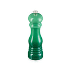 Green pepper mill on a white background