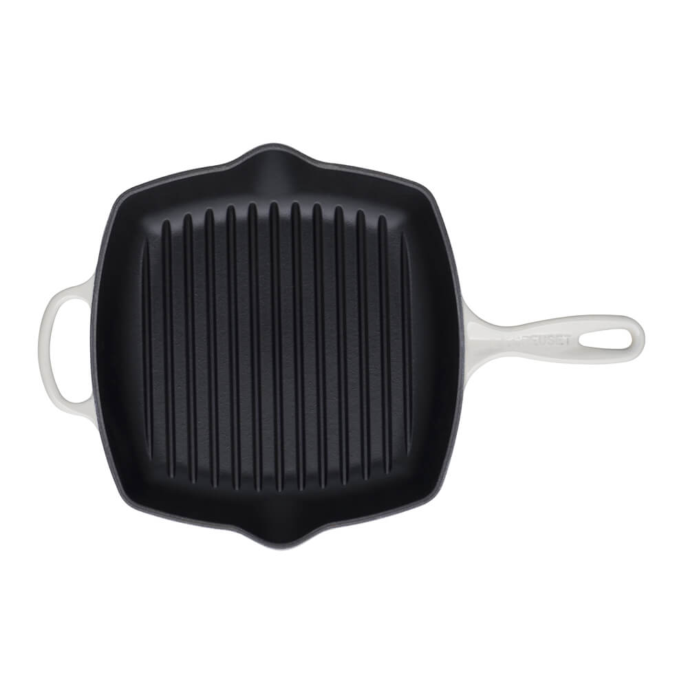 Meringue cast iron square grillit pan with ribbed surface on a white background