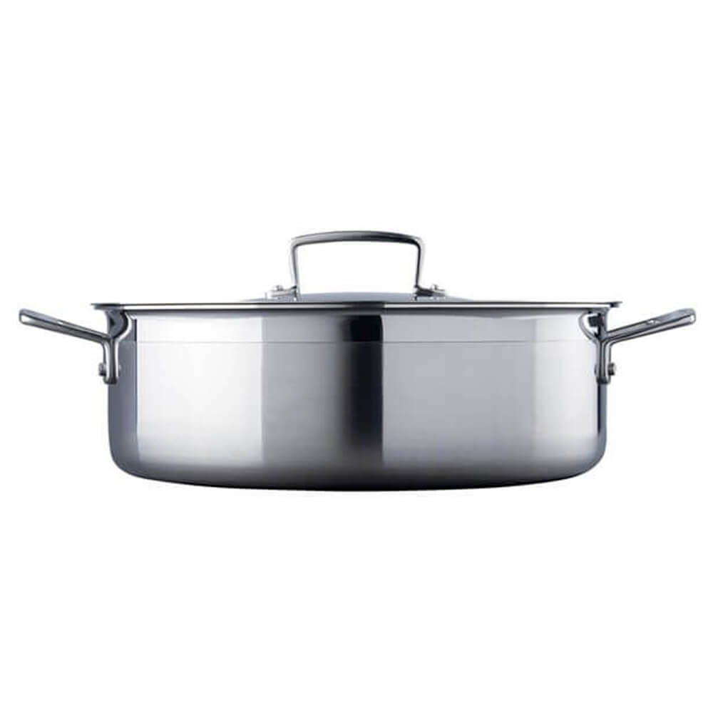 Stainless steel sauteuse with lid on a white background