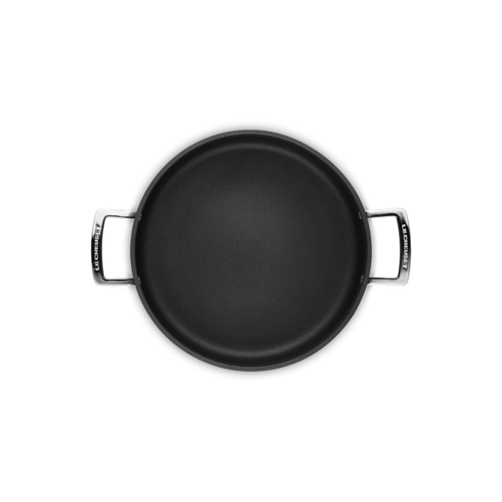 Black sauteuse with handles on a white background