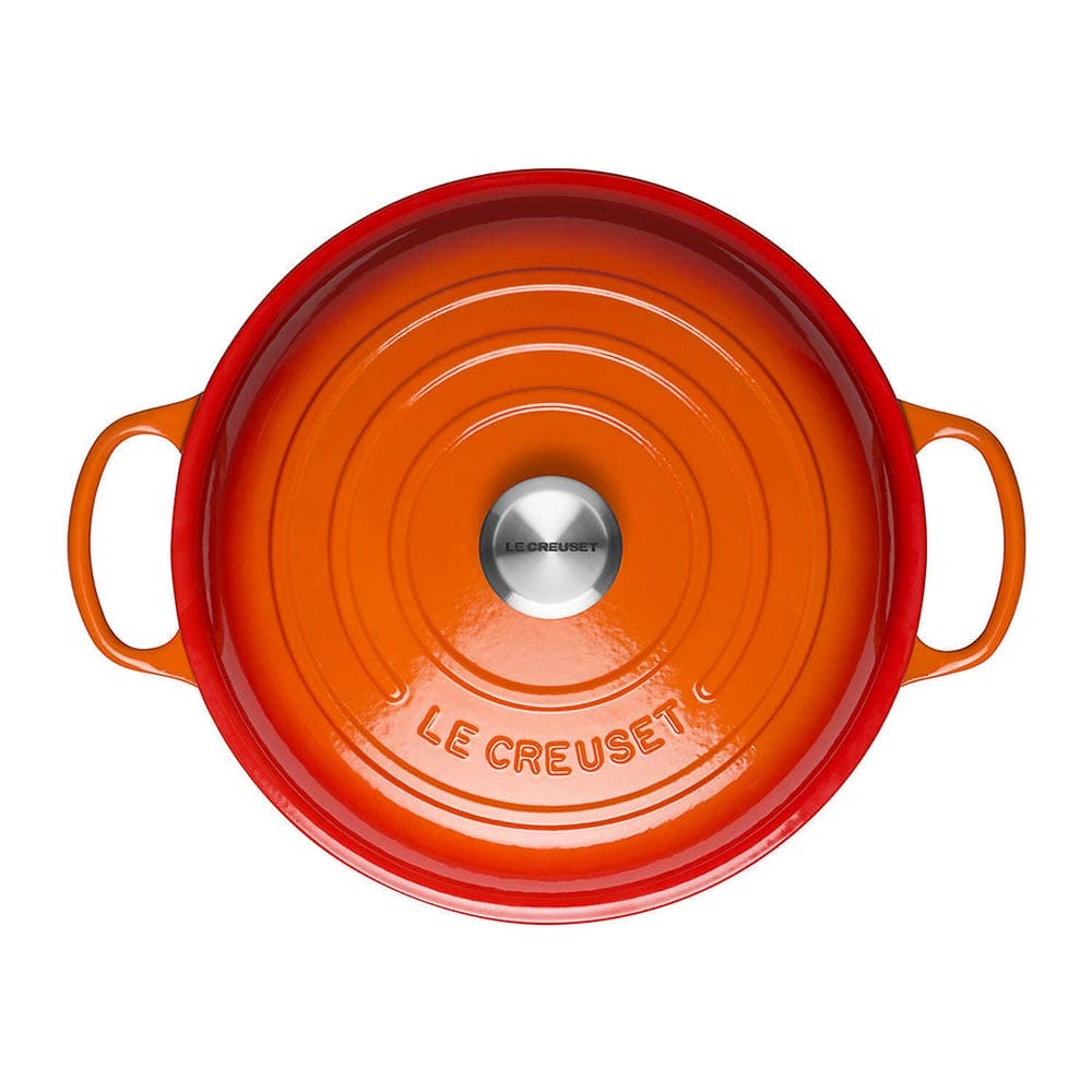 Volcanic Le Creuset casserole on a white background
