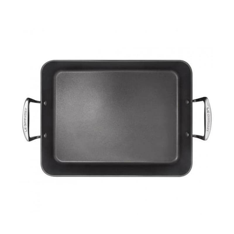 Black rectangular baking tray with handles on a white background