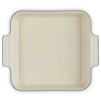 Baking dish with black rim on a white background