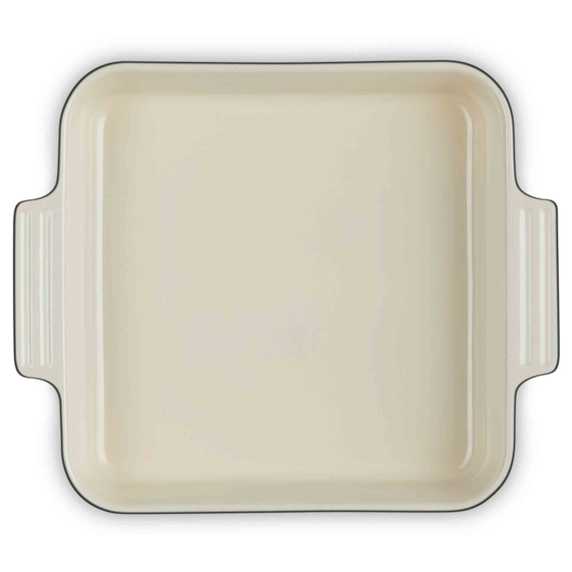 Baking dish with black rim on a white background