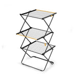 Three-tier metal drying rack with yellow accents on a white background