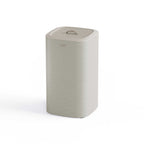 Ecru laundy bin with a lid on a white background