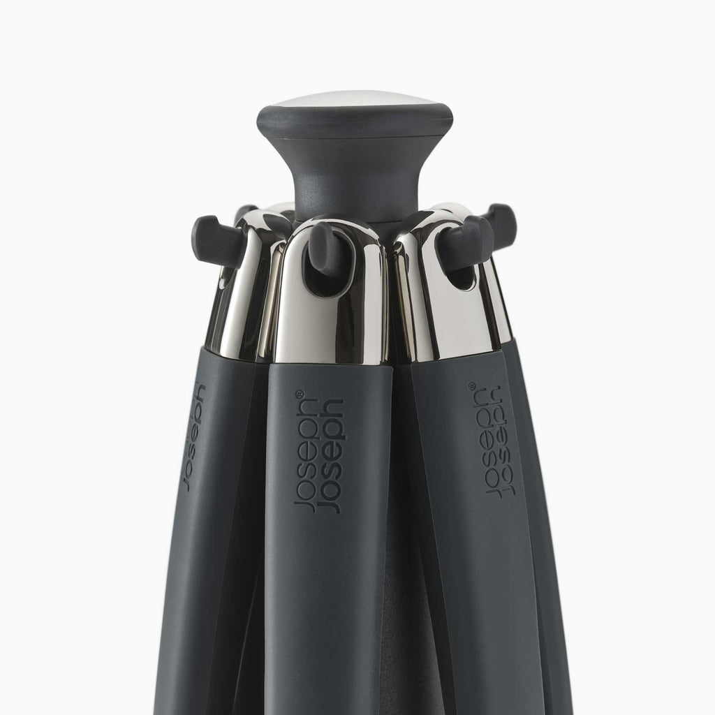 The top of a set of kitchen utensils on a carousel on a white background