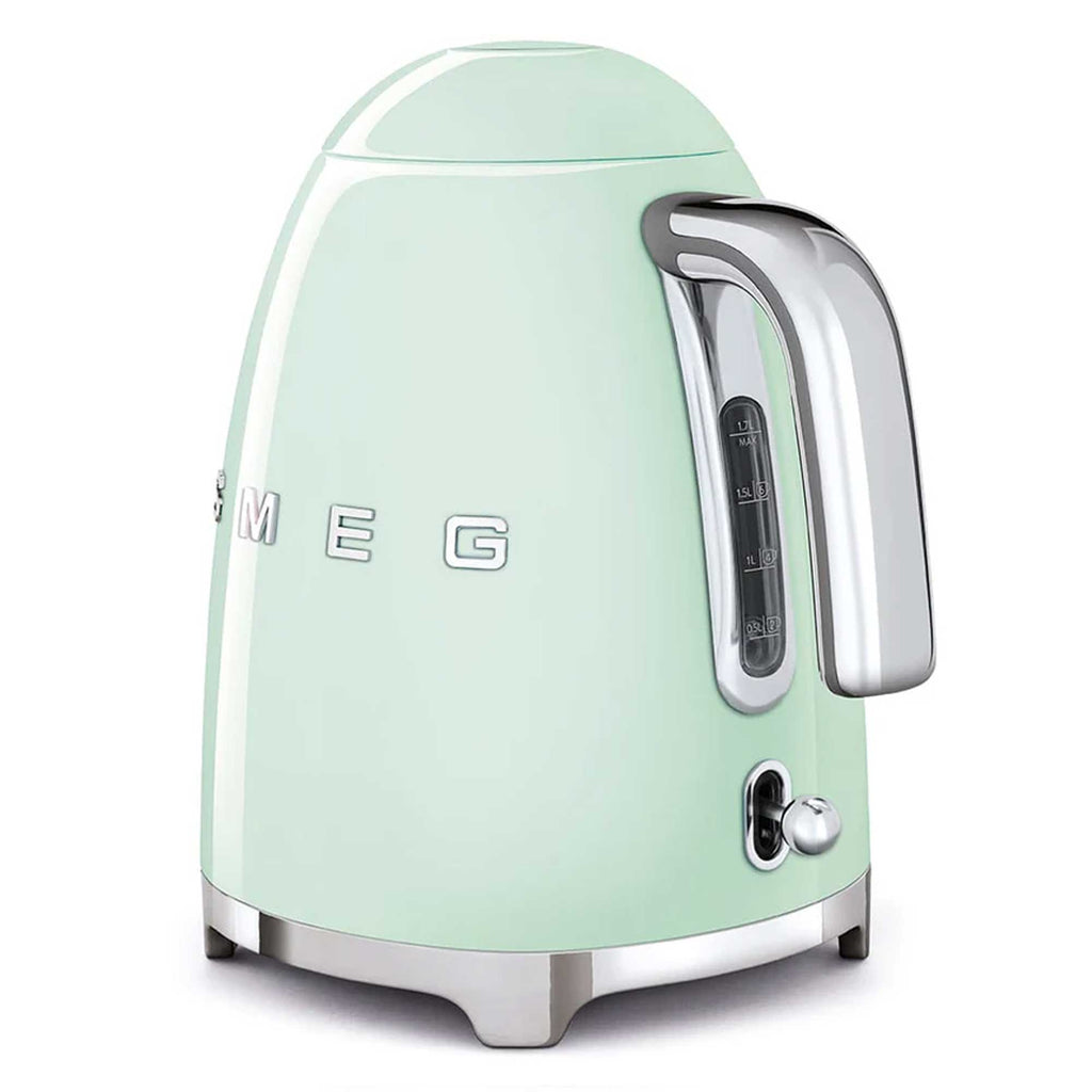 Pastel green kettle with silver accents on a white background