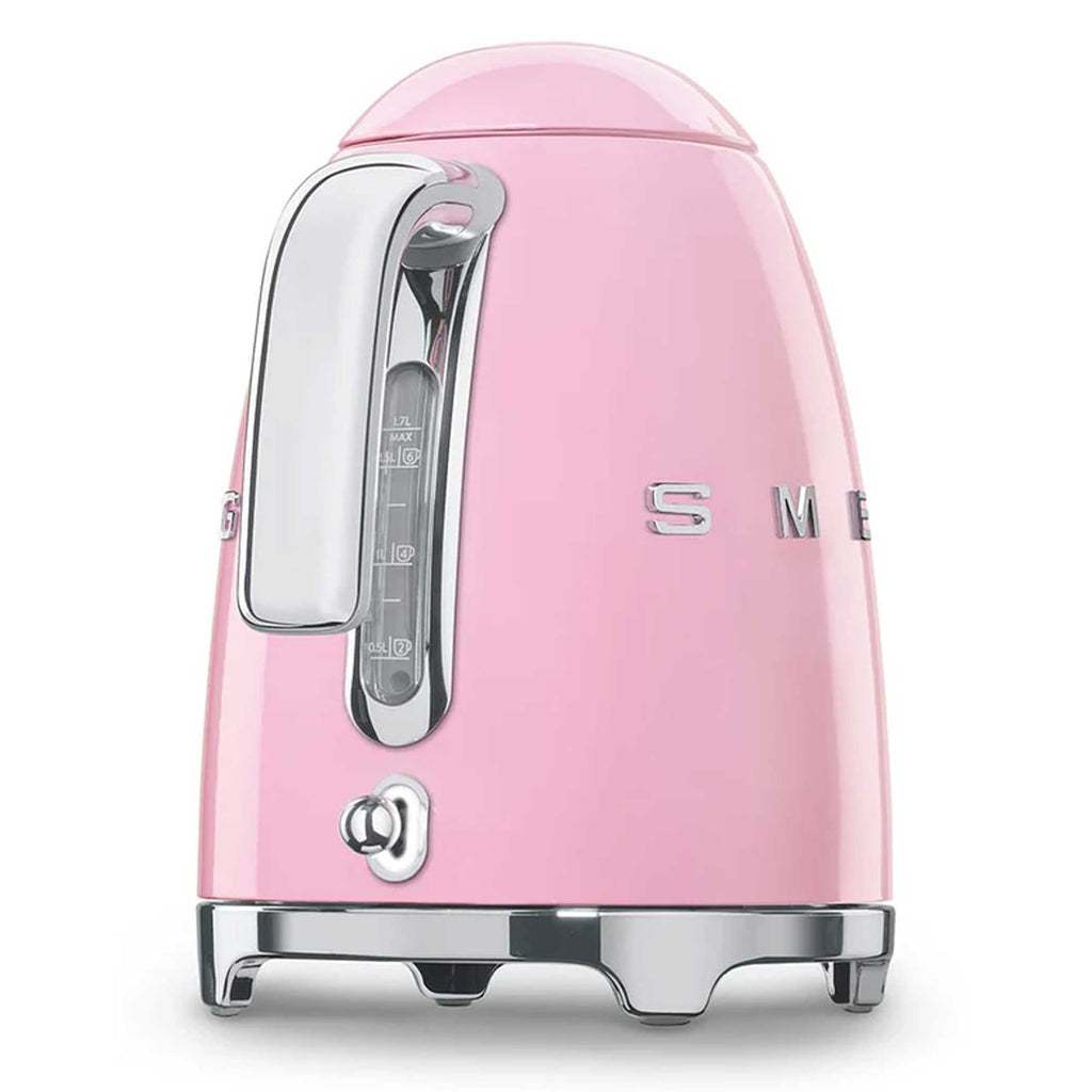 Pink kettle with silver accents on a white background