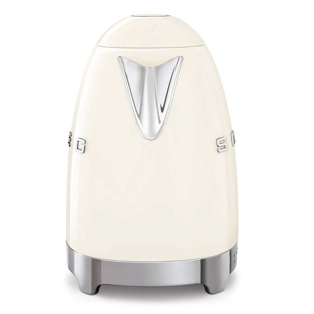 Cream-colored toaster with silver accents on a white background