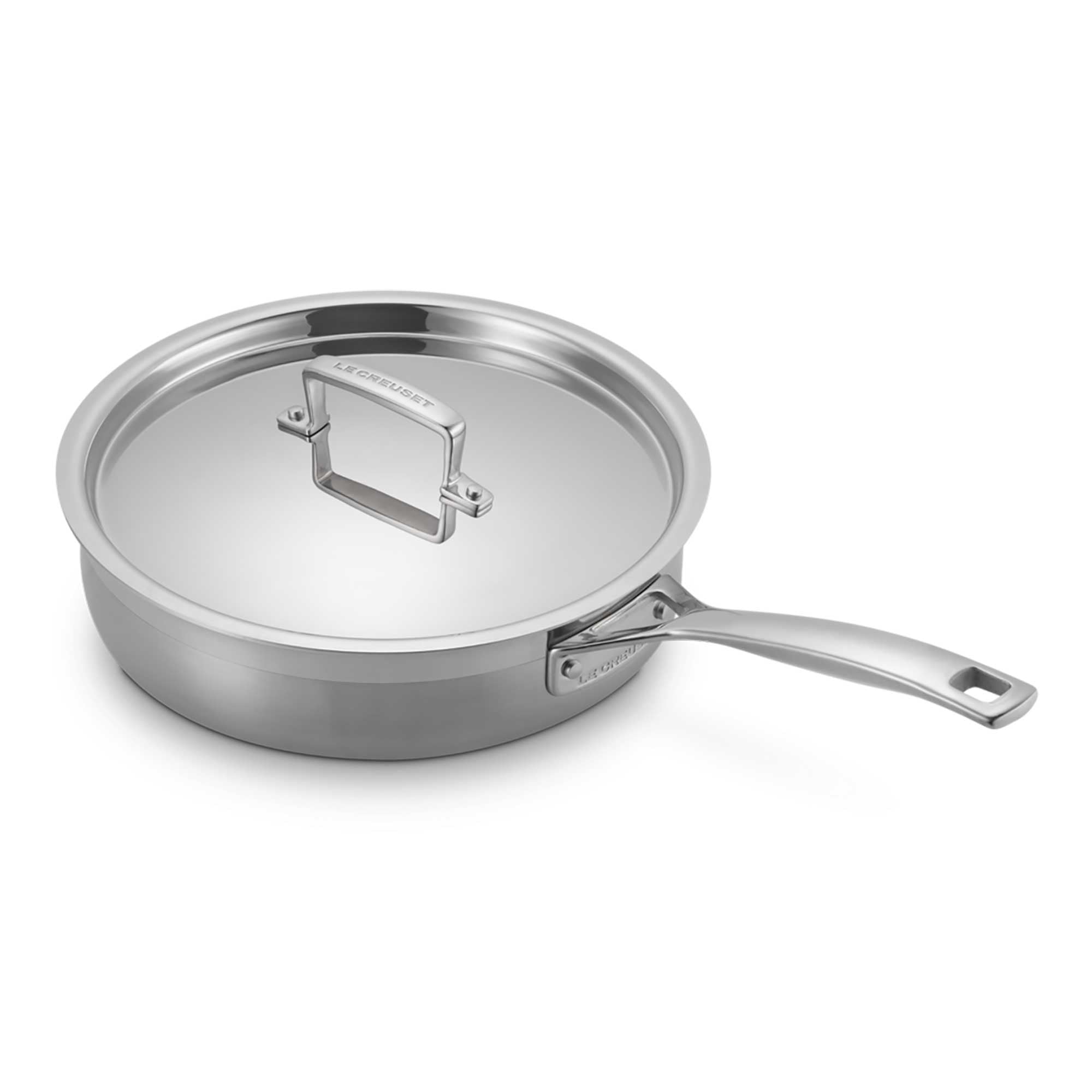 Stainless steel sauté pan with lid on a white background