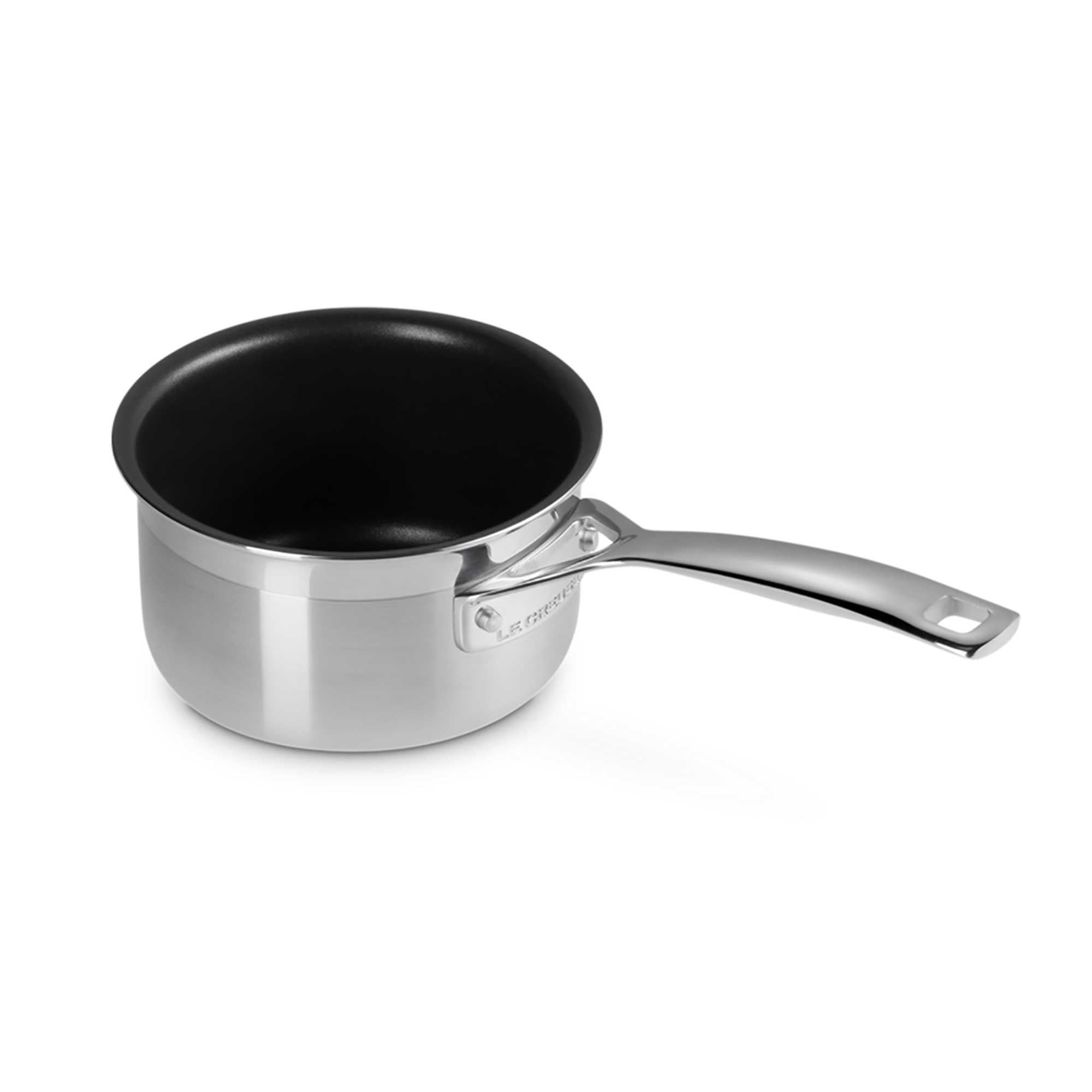 Stainless steel saucepan with black interior on a white background