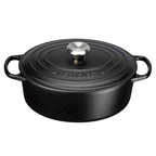 Satin black oval casserole with lid on white background