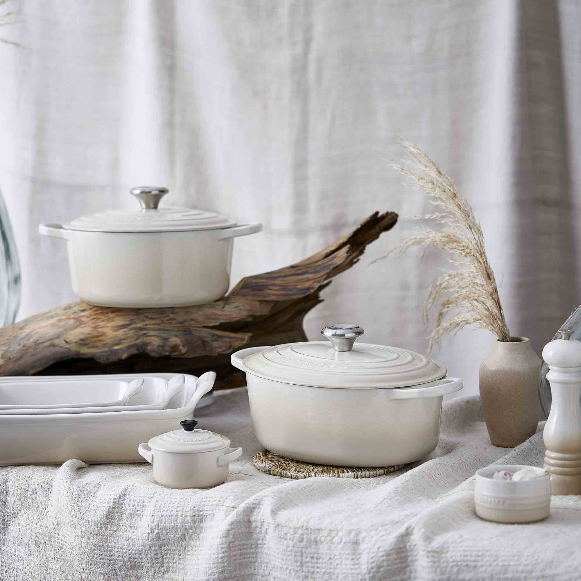 Le Creuset meringue cast iron casserole range on a soft background