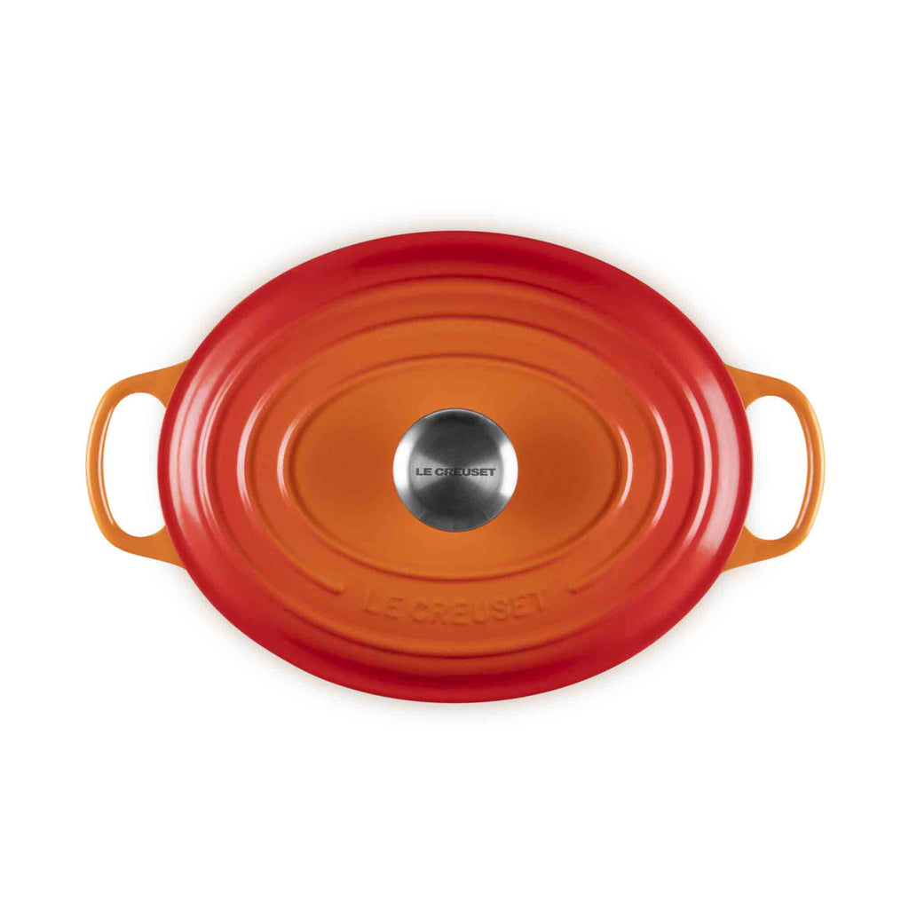 Le Creuset volcanic oval cast iron casserole with lid and handles on white background