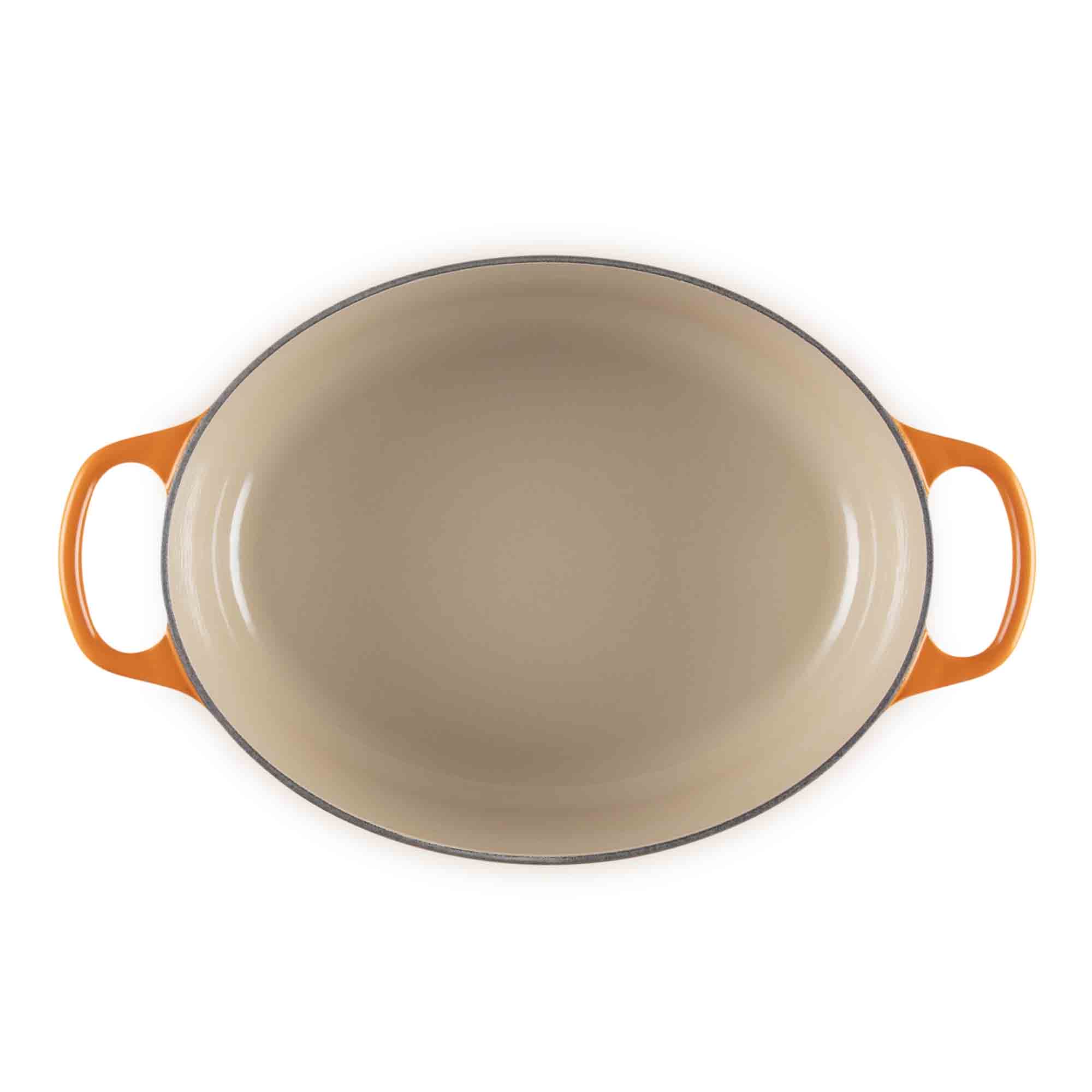 Le Creuset volcanic oval cast iron casserole with handles on white background