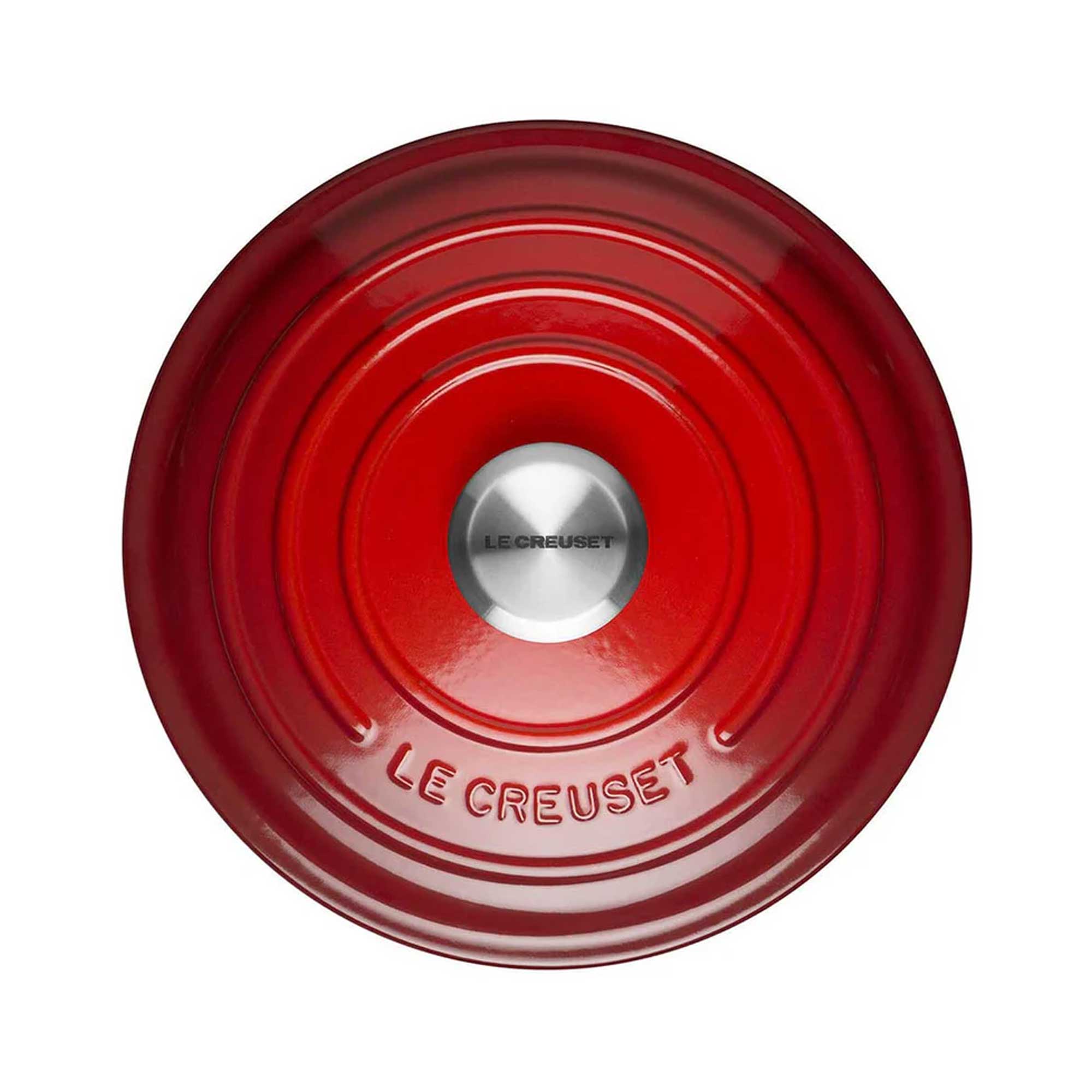 Red casserole lid with Le Creuset logo on a white background