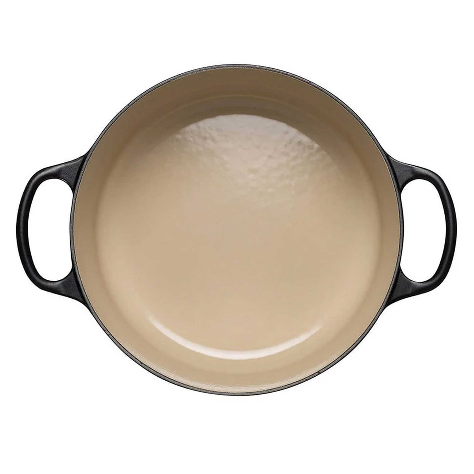 Black enameled cast iron casserole dish on a white background