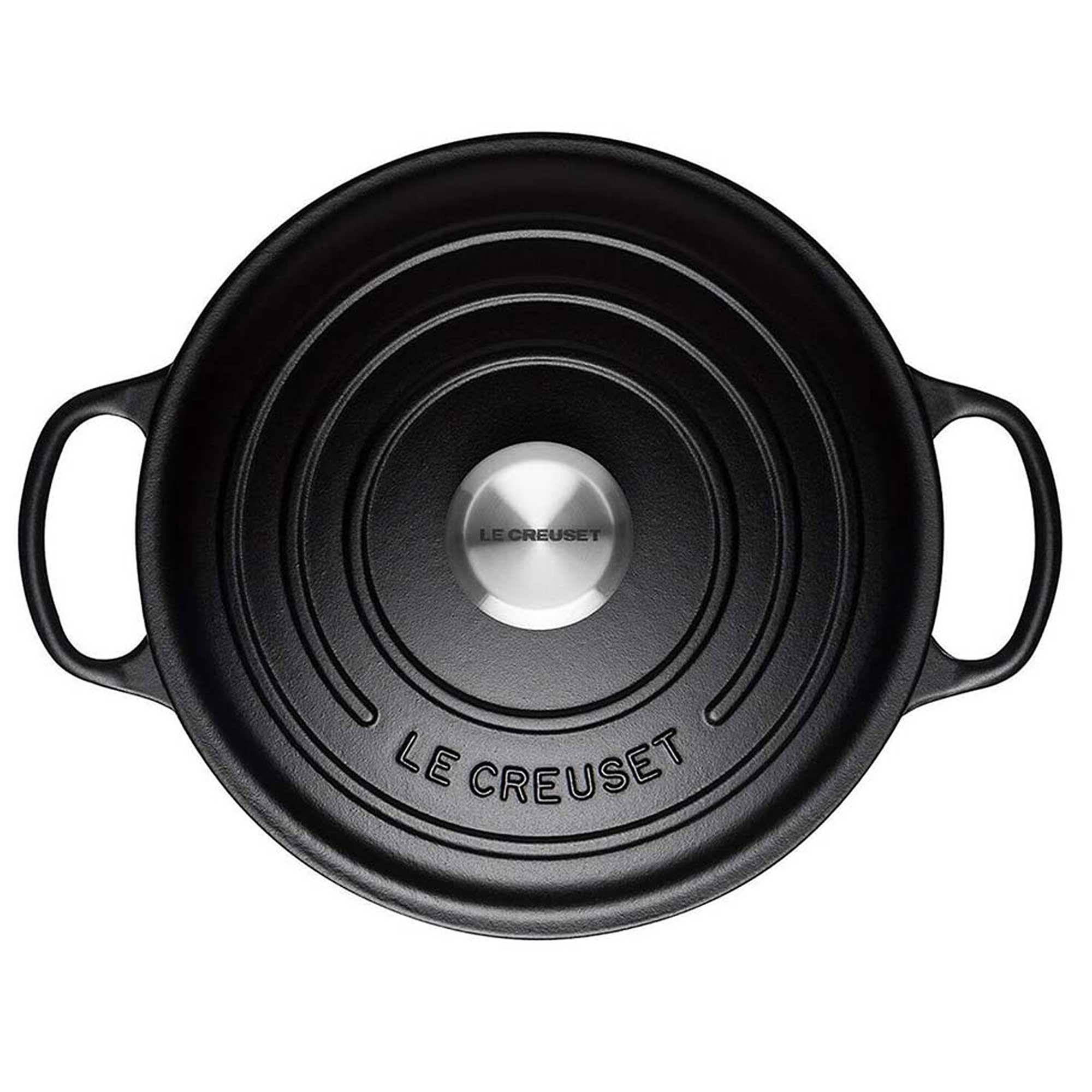 Black Le Creuset pot on a white background