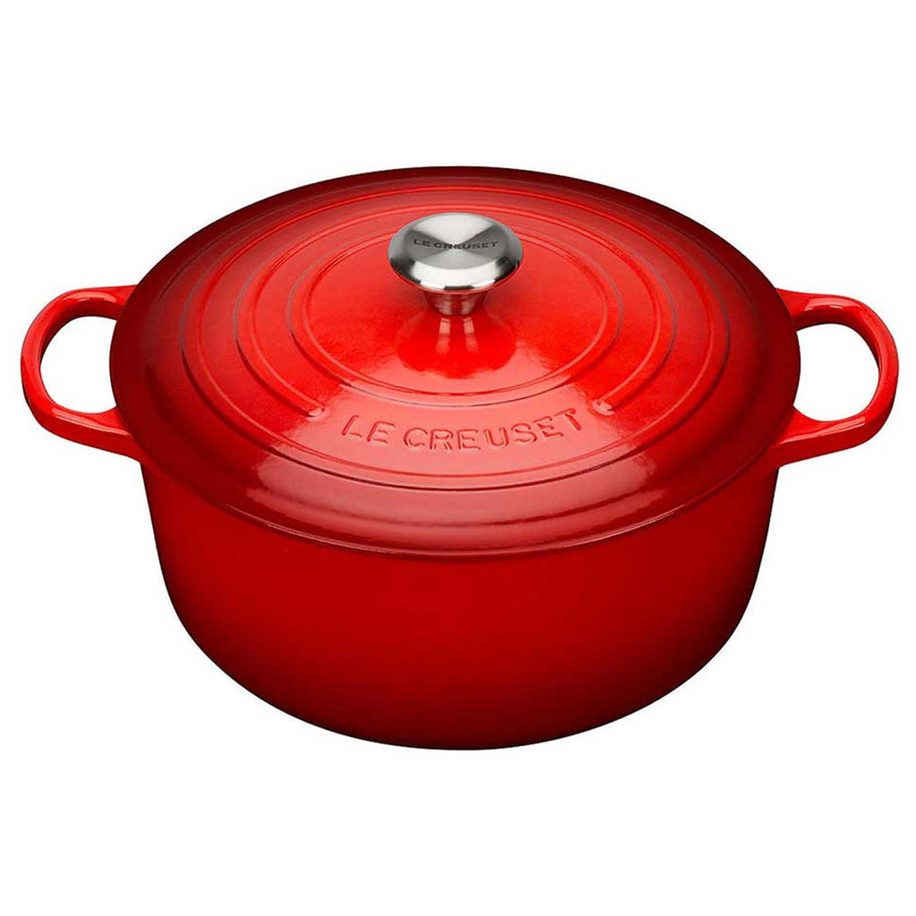 Red Le Creuset pot on a white background