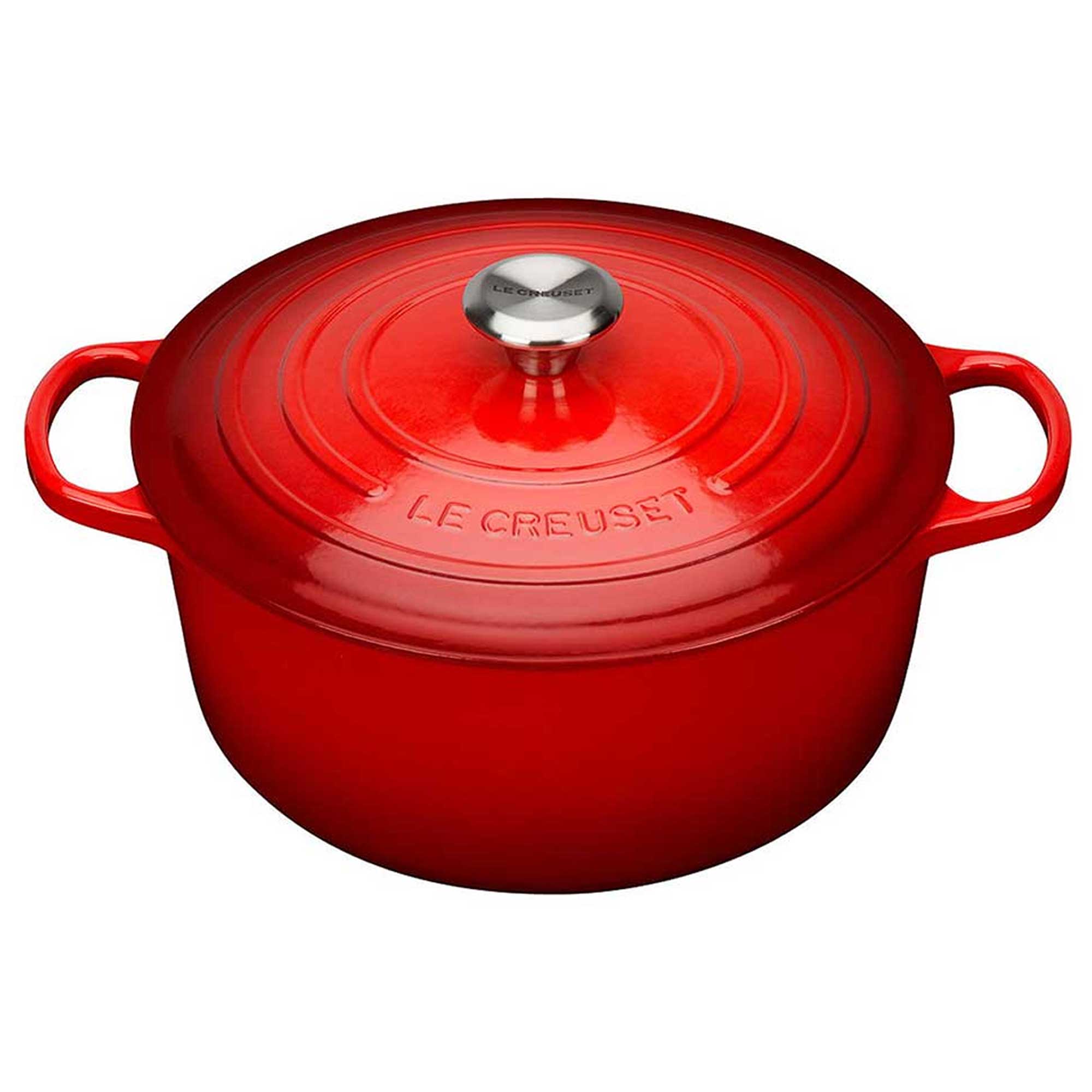 Red Le Creuset pot on a white background
