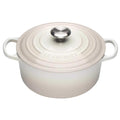 Meringue enameled cast iron Dutch oven with a lid on a white background