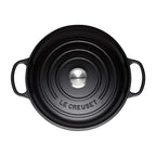 Black Le Creuset pot on a white background
