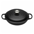 Black cast iron cookware with lid on a white background
