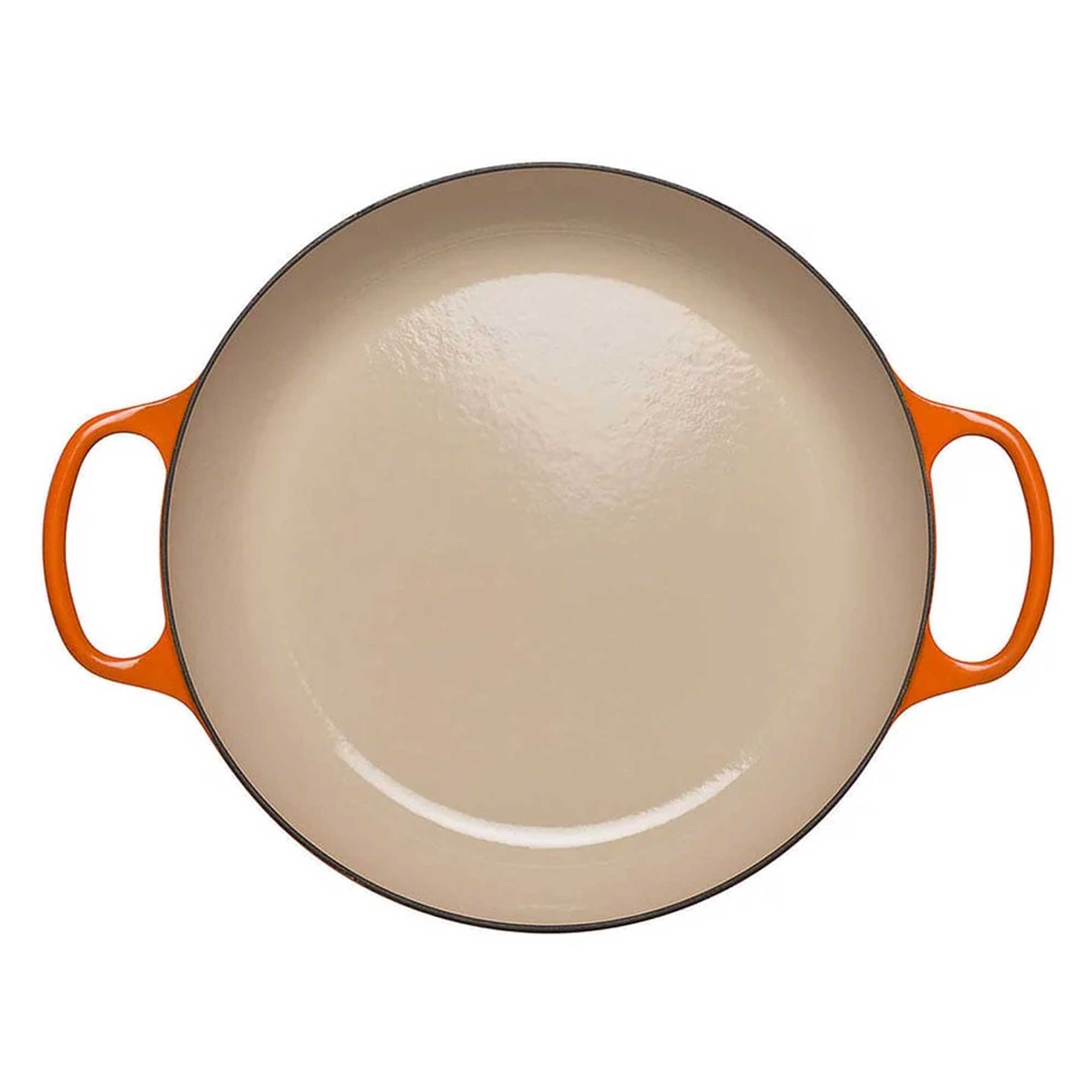 Round beige dish with orange handles on a white background