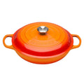 Orange enameled cast iron cookware with a lid on a white background