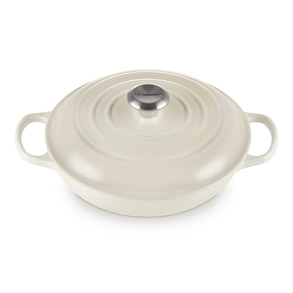 Meringue enameled cast iron cookware with lid on a white background