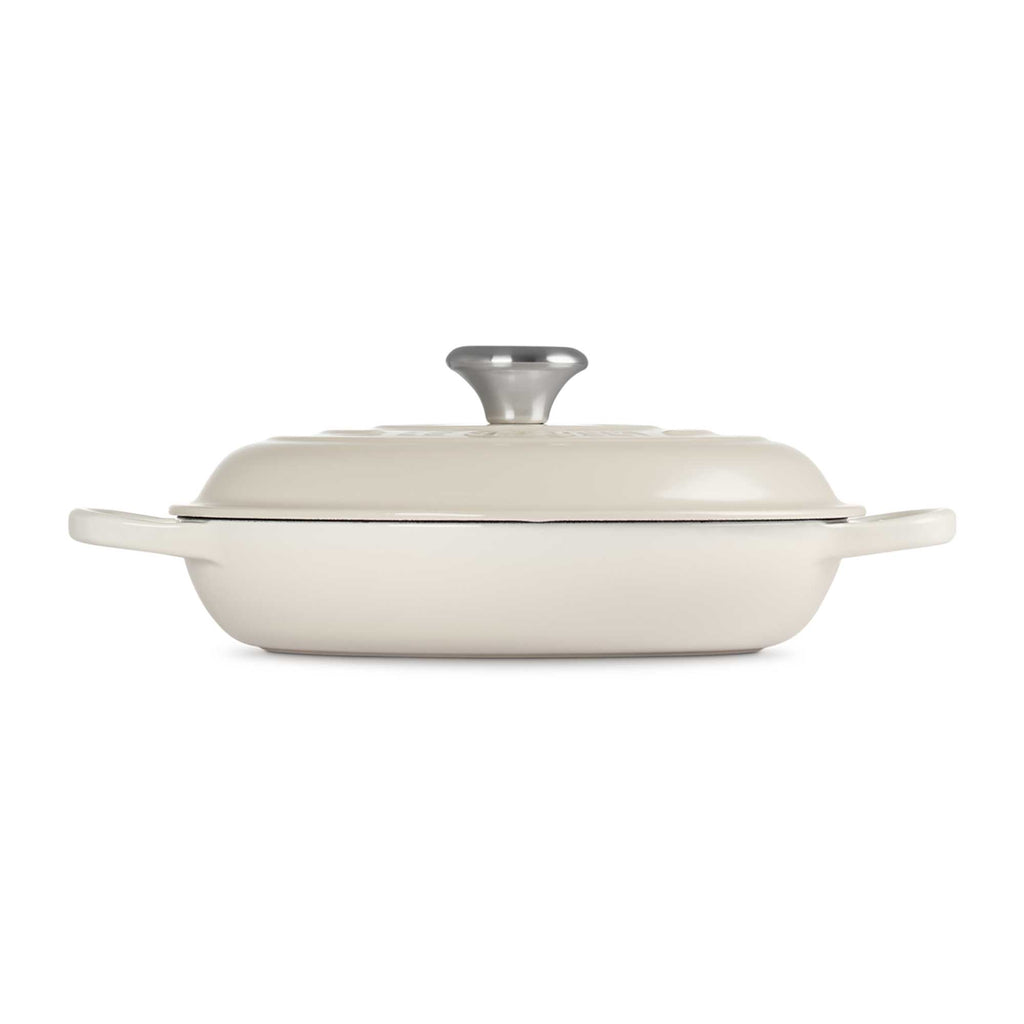 Meringue enameled cast iron casserole dish with lid on a white background