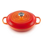 Volcanic Le Creuset cast iron casserole with a silver knob on a white background
