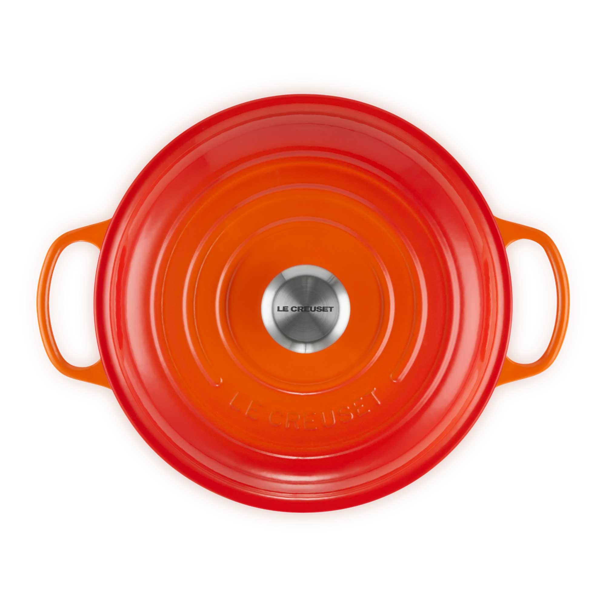 Volcanic Le Creuset pot lid with handles on a white background
