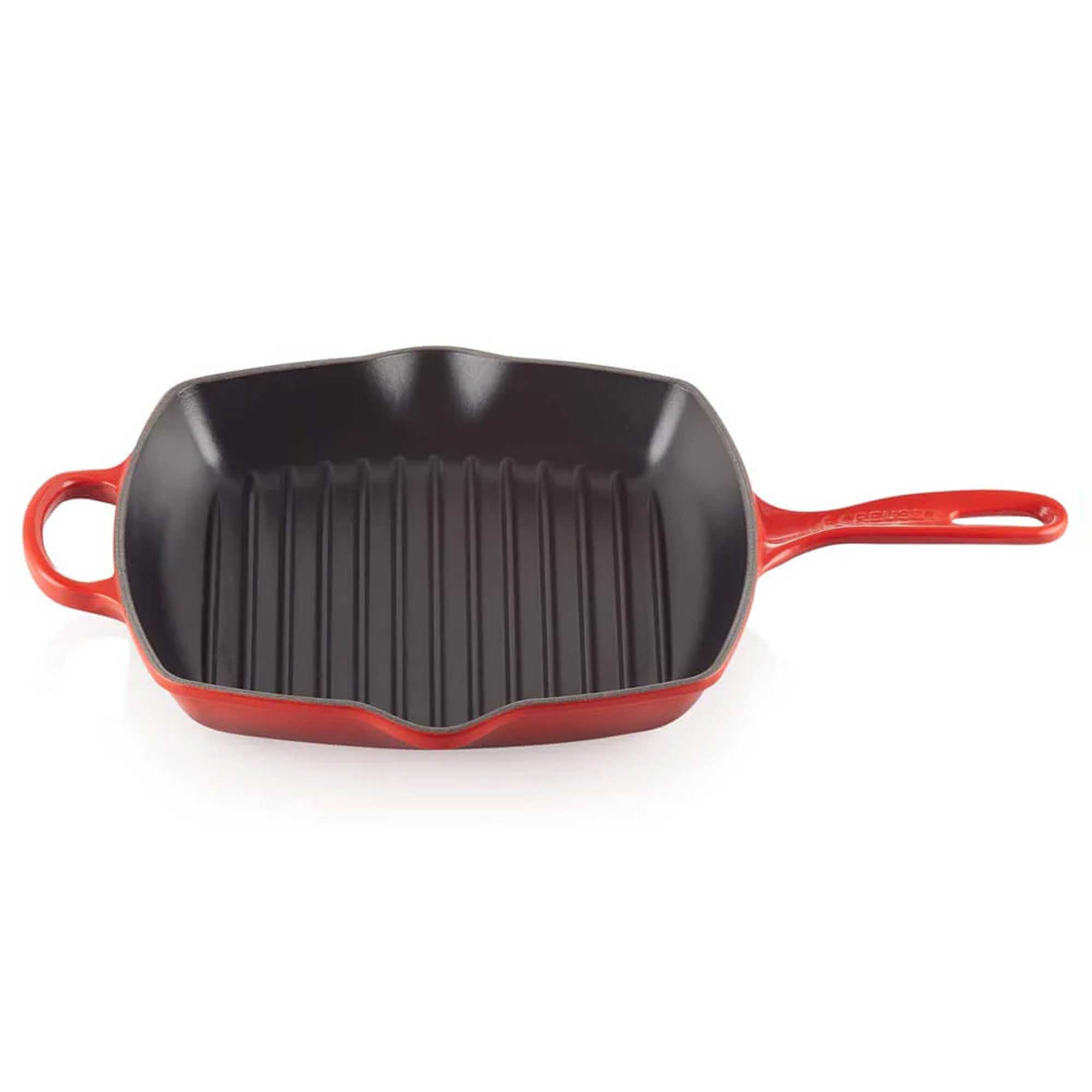 Red cast iron grill pan on a white background
