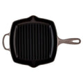 Black cast iron grill pan on a white background