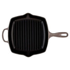 Black cast iron grill pan on a white background