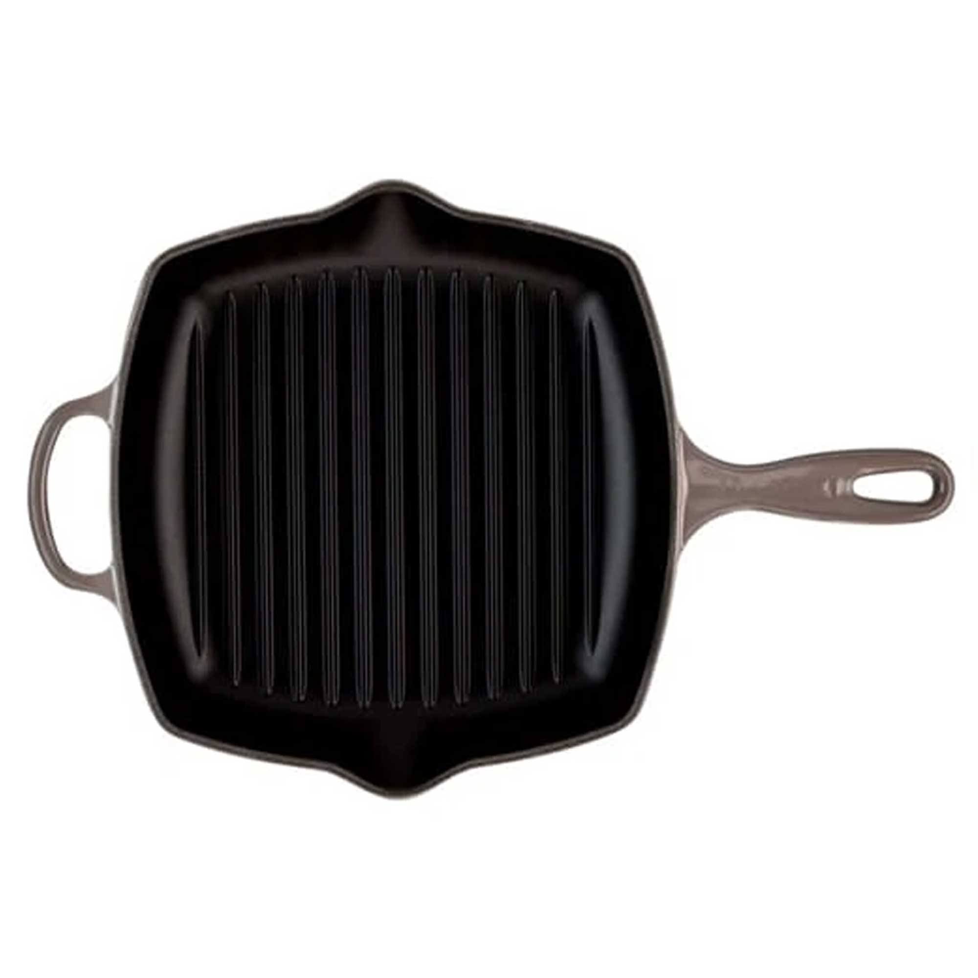 Black cast iron grill pan on a white background