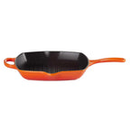 Orange cast iron grill pan on a white background