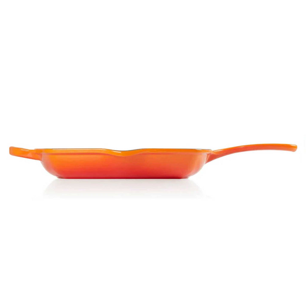 Orange frying pan on a white background