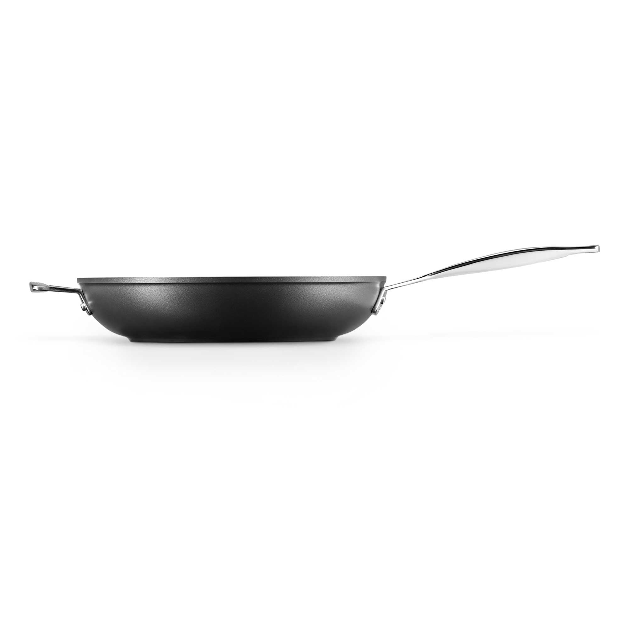 Black deep frying pan on a white background