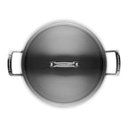 Top view of a Le Creuset pot with lid on a white background