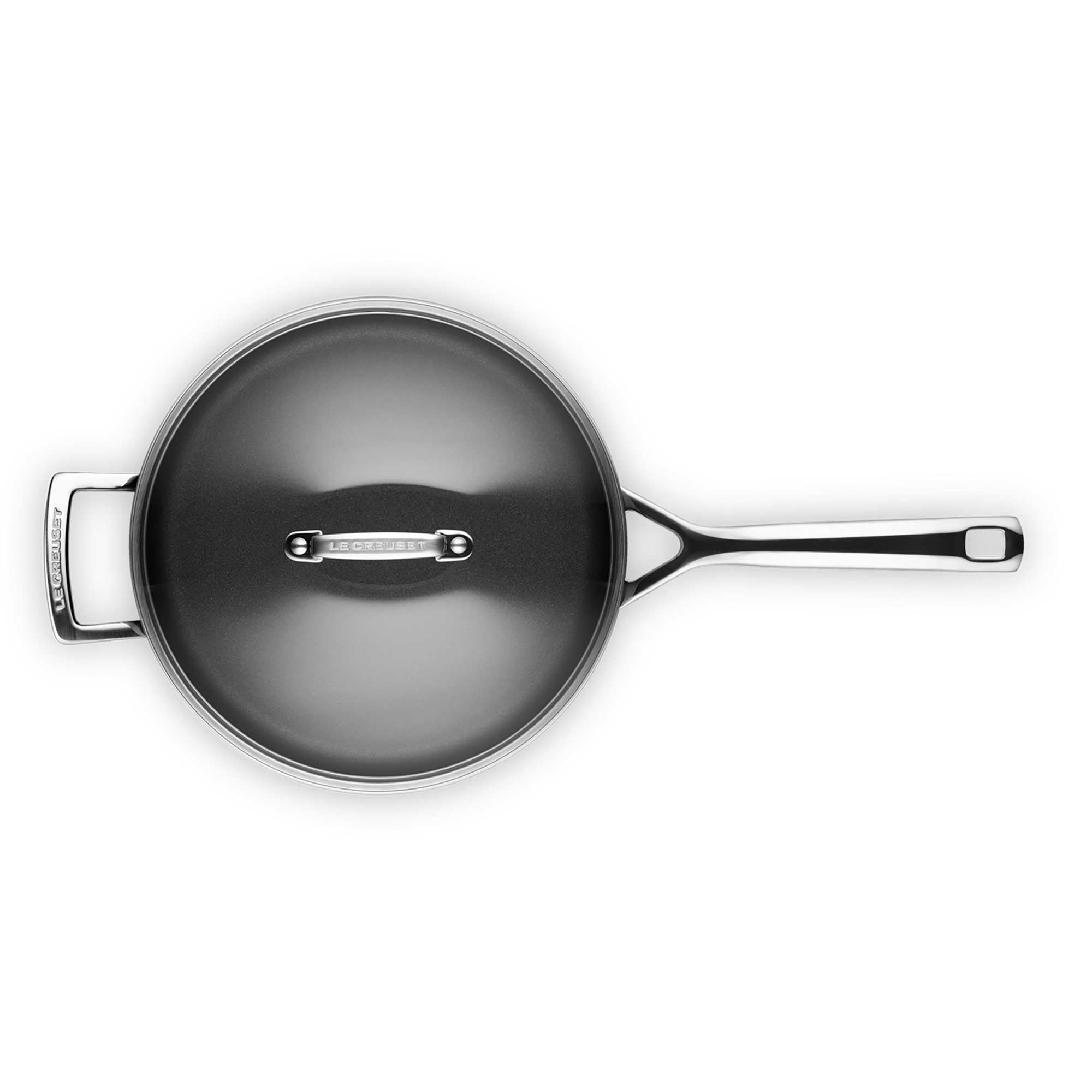 Black saute pan with a silver handle on a white background