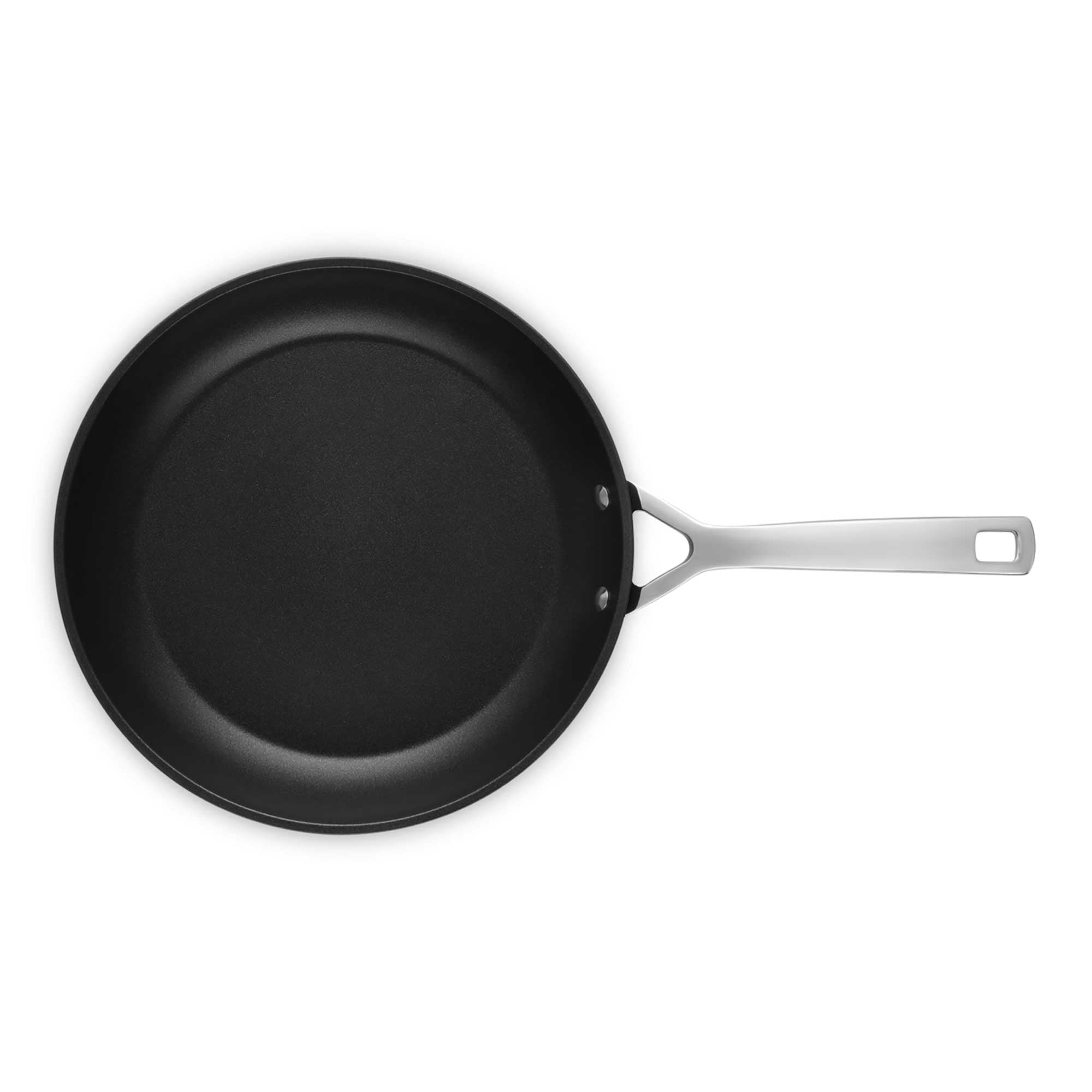 Black frying pan with a silver handle on a white background