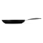 Black frying pan with a silver handle on a white background
