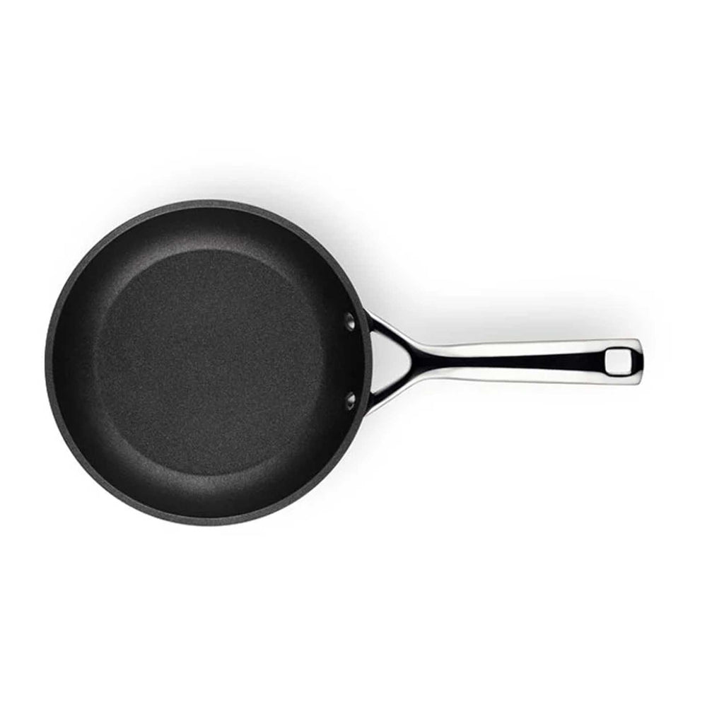 Black frying pan on a white background