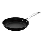 Black frying pan with a silver handle on a white background