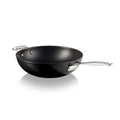 Black stir fry pan with a silver handle on a white background